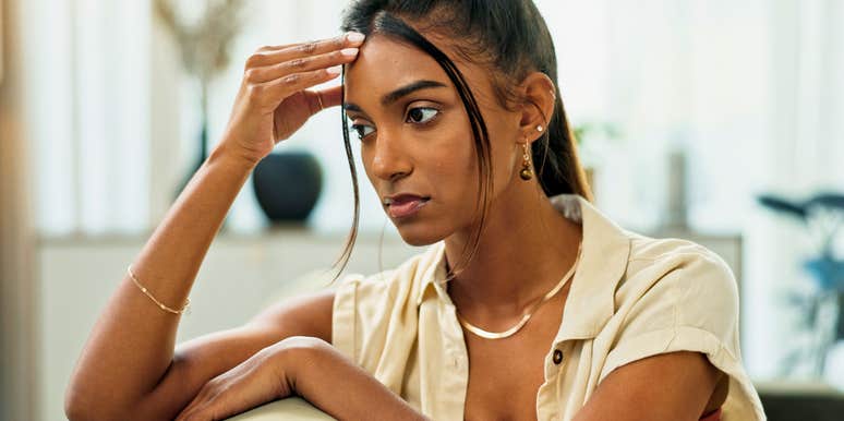 sad pensive woman whose parents unfairly criticized her growing up