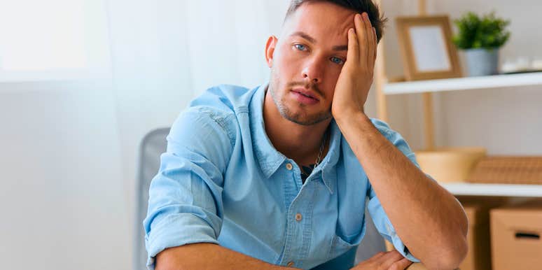 man sitting home alone with few friends and no social plans