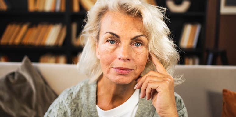 A confident woman in her sixties enjoying time at home, representing the freedom, empowerment, and new opportunities that define life for many women in their fifties and sixties.