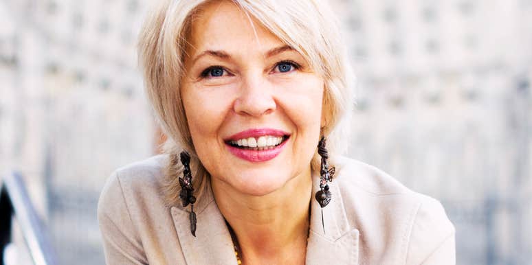 Beautiful middle-aged woman smiling confidently, illustrating healthy habits that help people in their fifties and sixties age well