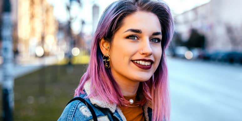 woman who dyes her hair fun colors smiling outside