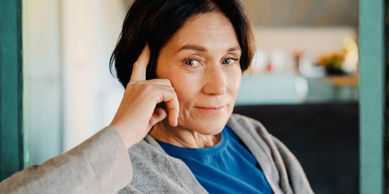 A vibrant woman in her sixties looking at the camera with a clear, focused expression, illustrating the proactive lifestyle choices that brain health experts recommend for dementia prevention.