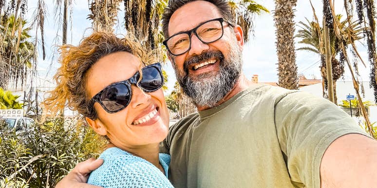 Happy middle-aged couple smiling together, illustrating how couples in their fifties and sixties reconnect by sharing meaningful life memories