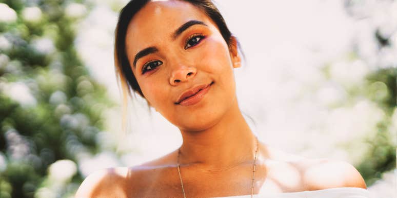 A close-up portrait of a woman with a kind, sensitive face and a soft gaze, illustrating the deep empathy and emotional intelligence that Highly Sensitive People bring to relationships.
