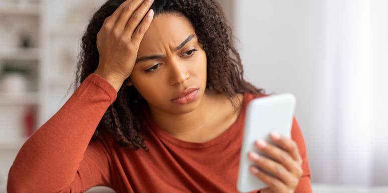 upset woman who fell for a scam because of the economy