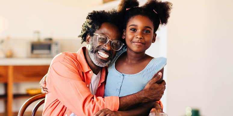 Dad hugging daughter which is no big deal 