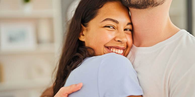 introverted woman showing love and affection hugging her partner