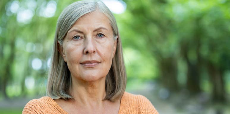 woman standing outside looking into camera