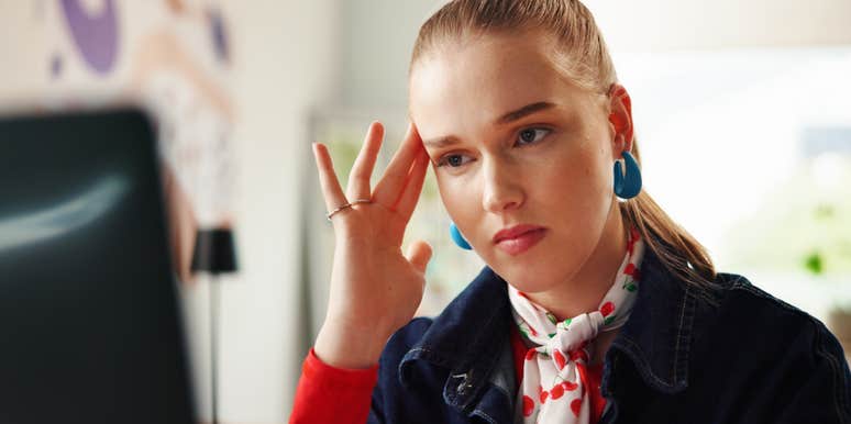 stressed woman sitting at desk