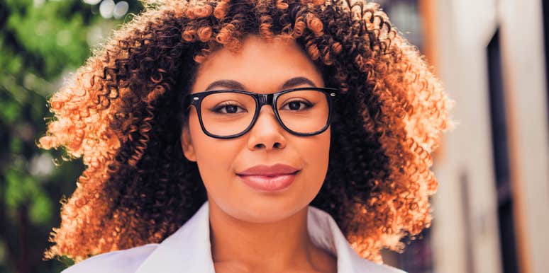 smiling woman who is more intelligent than she knows