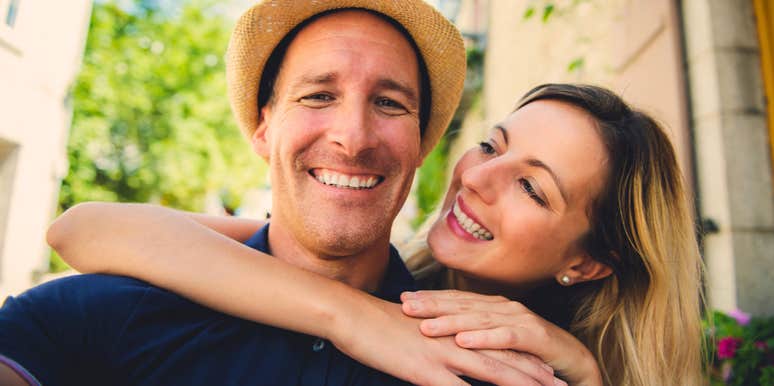 happily married husband taking a selfie with wife he adores