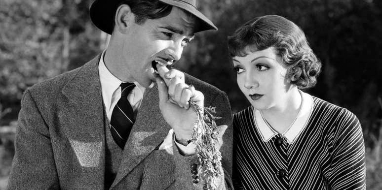 Clark Gable and Claudette Colbert in a scene from the 1934 film 'It Happened One Night'; illustrating the 'lost art' of classic romance and the enduring appeal of black-and-white films among movie enthusiasts.