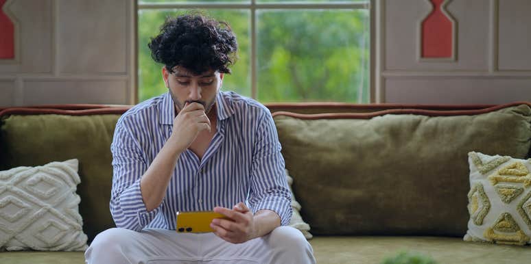 gen z man betting on sports on his phone