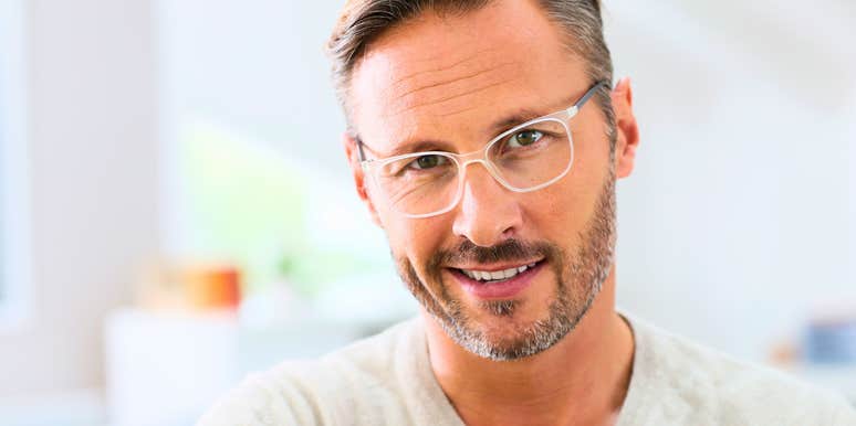 high-iq man smiling happy about his hobbies and intellect