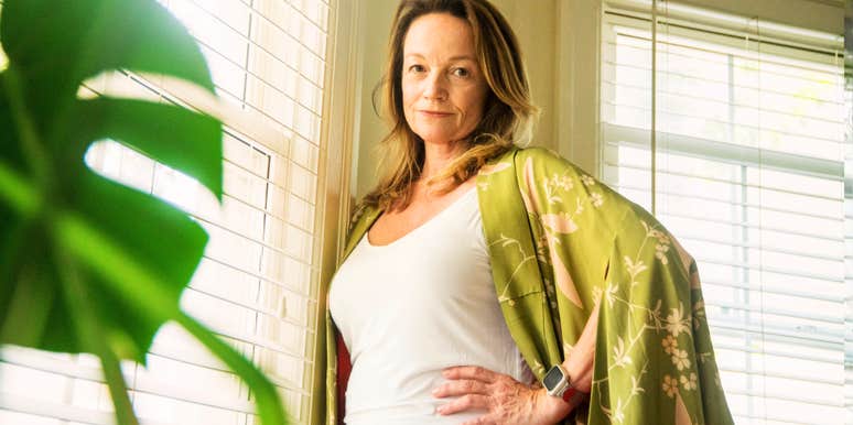 portrait of Mature woman at window