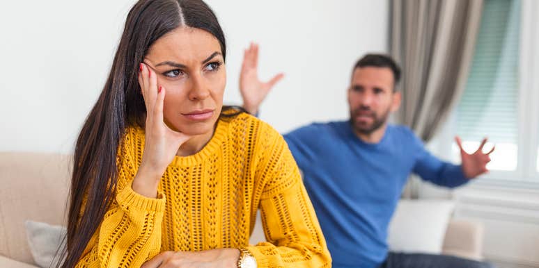 man arguing with upset girlfriend over household responsibilities