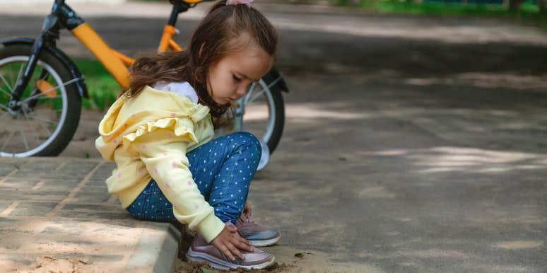 little girl left alone on the street by her parents