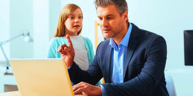 father paying more attention to work than his daughter