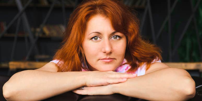 serious pensive woman who doesn't want tattoos