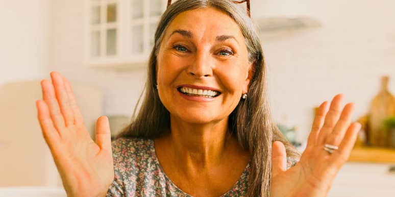 calm and relaxed older woman smiling confidently