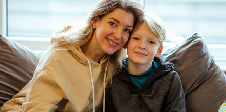smart parent sitting next to her son teaching him brilliant old-fashioned lessons