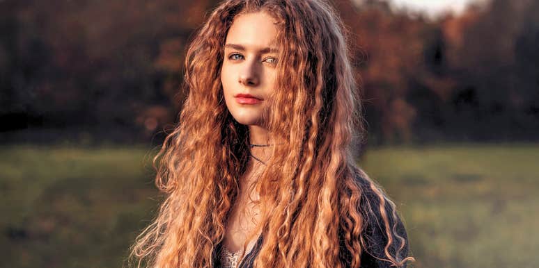 spiritually gifted woman with long hair feeling free
