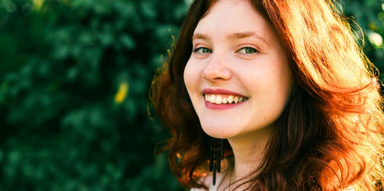 superstitious woman smiling in the sun