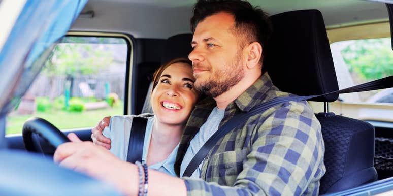A portrait of a husband and wife sharing a quiet moment of connection during travel.