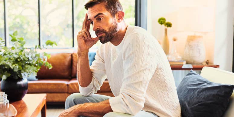 pensive man wanting to make his ex feel sad without him thinking at home