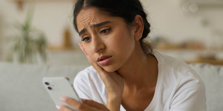 woman reading texts in disappointment because man said he can't plan their date