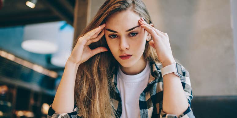 Serious intelligent woman looking stern to avoid emotions