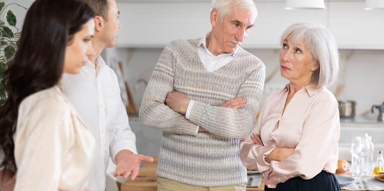 man talking to older parents