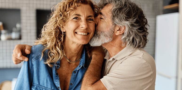 Happy couple smiling because the husband is so loving 