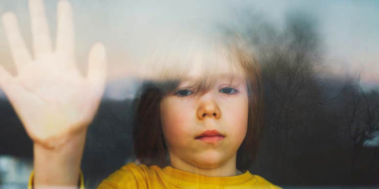 A young child looking lonely and distressed in an isolated room; illustrating the impact of a 'high-conflict home' on the developing brain and how these early experiences dictate adult emotional regulation.