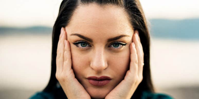 A devastated woman looking ahead deep contemplation; illustrating the initial stage of emotional repair after a significant breach of trust in a relationship.