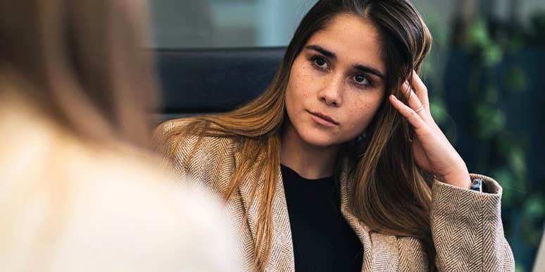 Professional woman letting a co-worker know she doesn't like her kindly