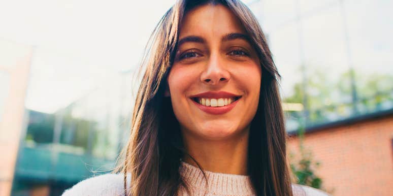 intelligent woman who thinks ahead smiling to herself
