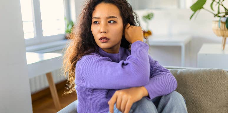 young woman feeling stressed overwhelmed over money