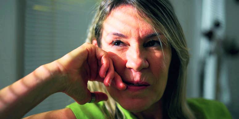 intelligent woman sitting alone at home disliking people