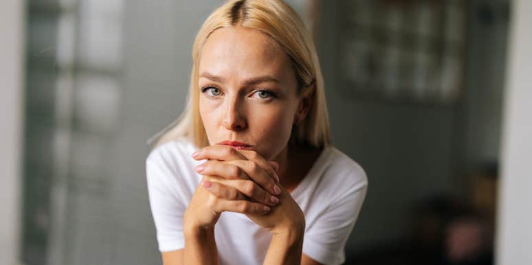 Woman who refuses to take accountability looks slyly at the camera 