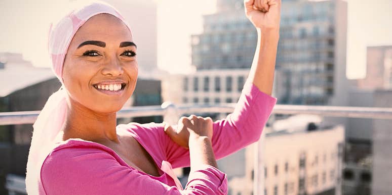Brave young woman who isn't afraid of being strong flexing her muscles 