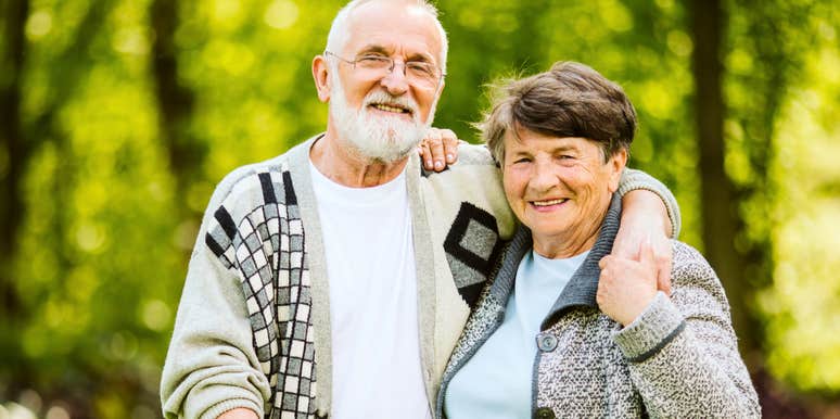 loving grandparents standing together outside