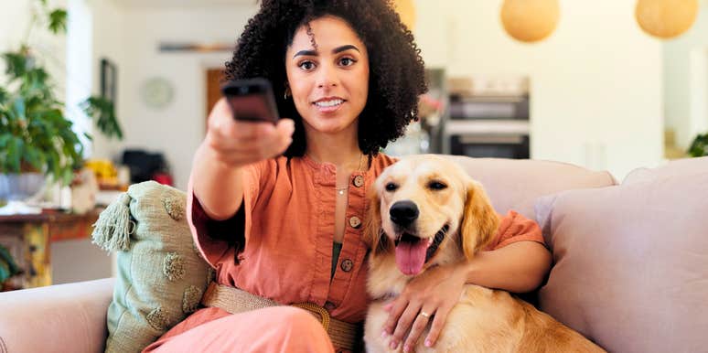 woman on couch spending her weekend watching tv