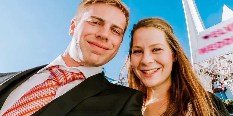 A close-up portrait of a newlywed couple getting married in an iconic Vegas wedding setting; illustrating 'the wedding budget paradox' and how high-expenditure milestones can correlate with long-term marital strain.