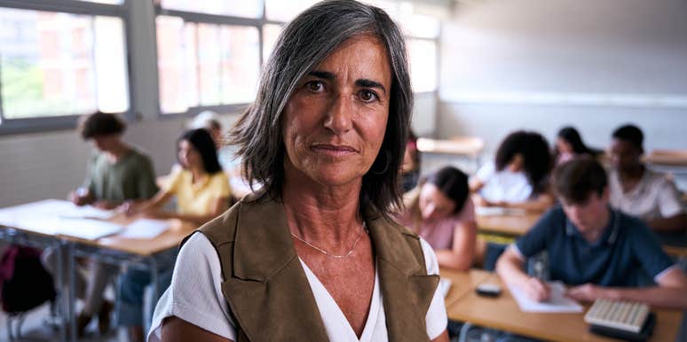 serious older female teacher in classroom
