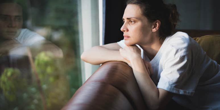 sad young woman feeling homesick