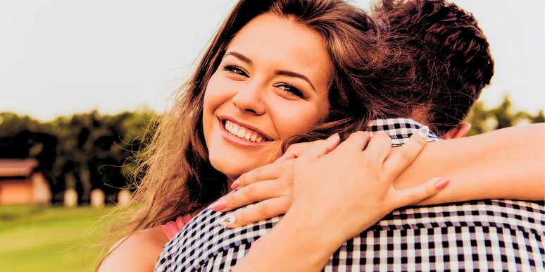 happy woman hugging man who loves her