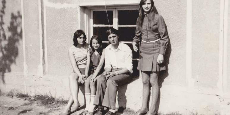 group of teens in the 1970s sitting outside together