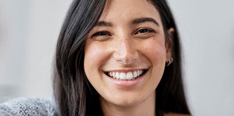woman who is happy based on her social class