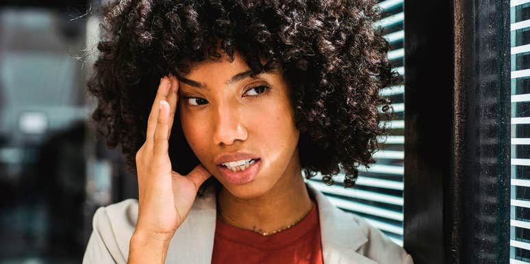 highly intelligent woman feeling indifferent and thinking